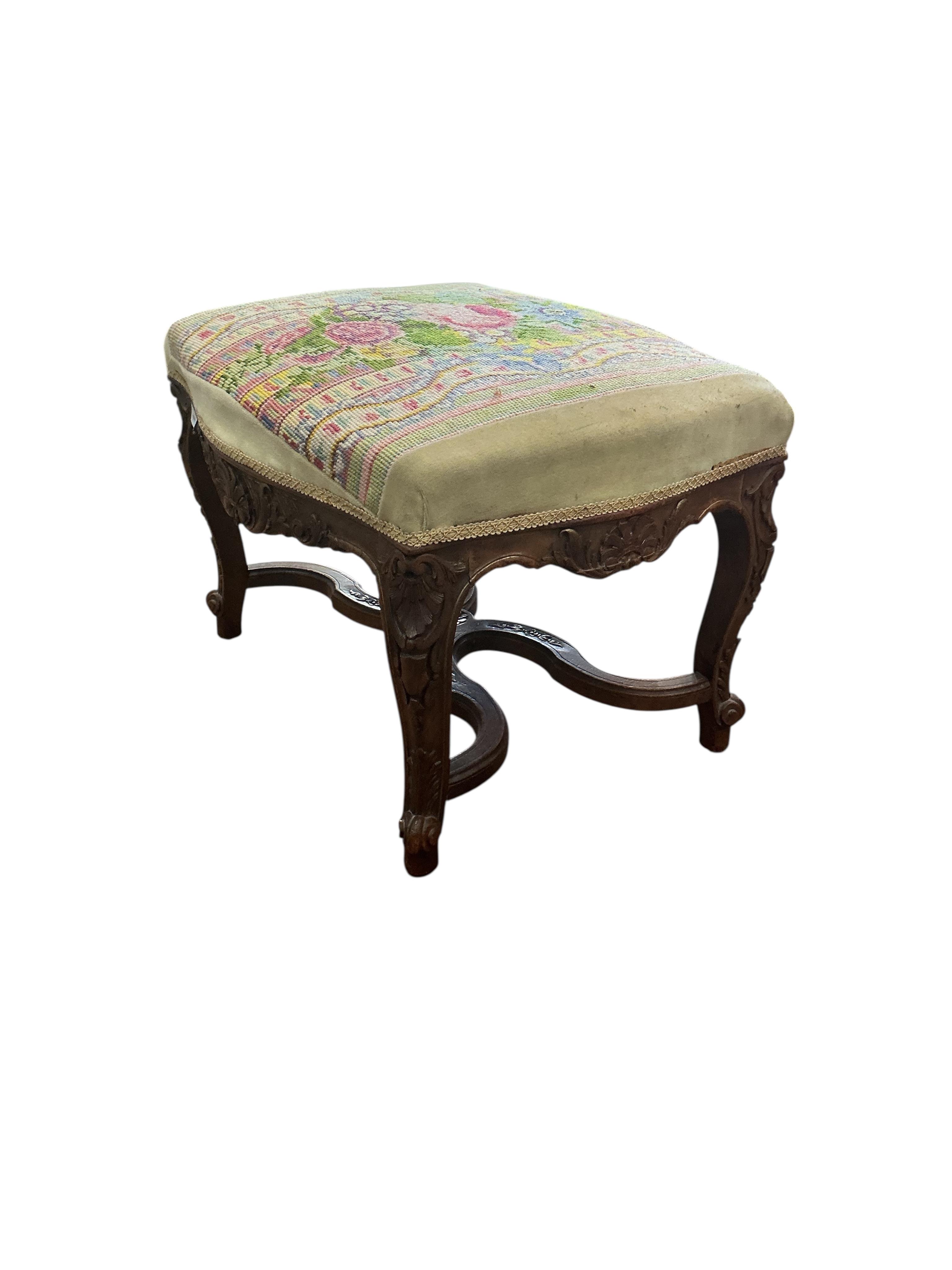 A 19th century French carved walnut dressing stool, with a tapestry upholstered top, width 62cm, depth 48cm, height 44cm